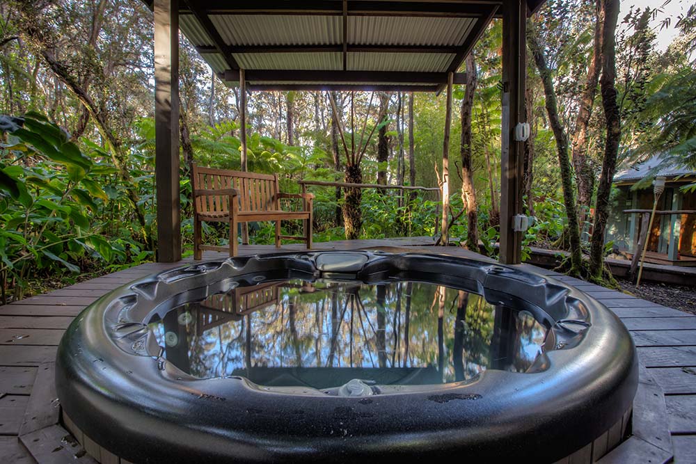spa tub in forest big island hawaii cottage